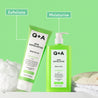 Q+A AHA Exfoliator Body Scrub and Body Lotion on a green background