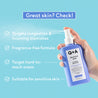 Hand holding a bottle of Q+A Salicylic Acid Clarifying Body Spray against a blue background with text highlighting product features.